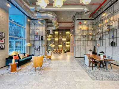 a large room with a table and chairs and a couch at 2bedroom apartment Dubai Hills in Dubai