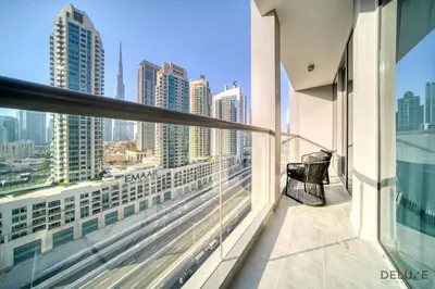 a balcony with a bench and a view of the city at Exclusive Offer Cozy Stay with Burj Khalifa Views by Deluxe Holiday Homes in Dubai