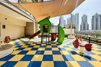 a childrens play area with a checkered floor at Luxury Escapes - Newly furnished 1BR Apartment - 8 BLVD WALK DOWNTOWN in Dubai