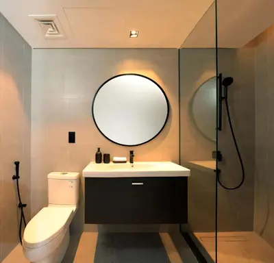 a bathroom with a sink and a toilet and a mirror at Cozy Studio whit balcony 15NS in Dubai