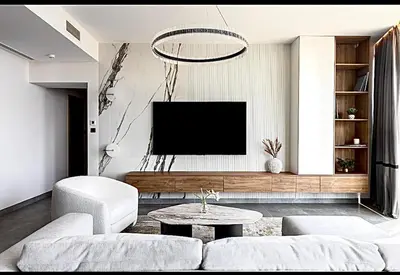 a living room with a couch and a tv at Mira Holiday Homes - Serviced 2 bedroom in Dubai Marina in Dubai