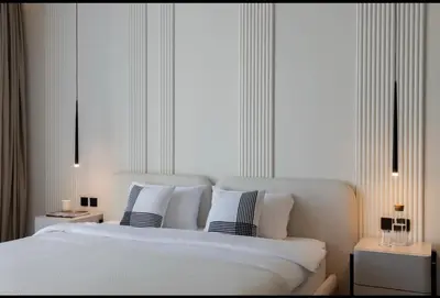 a bedroom with a large white bed with pillows at Mira Holiday Homes - Serviced 2 bedroom in Dubai Marina in Dubai
