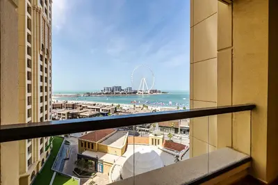 a view of the beach from a balcony of a building at Amazing 1BR With Sea View Rimal 4 JBR - NOX Holiday Homes in Dubai