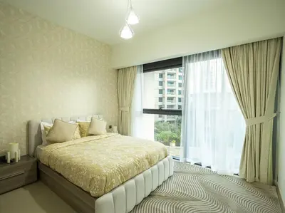 a bedroom with a bed and a large window at MH - ACT TOWER - Downtown -1Bedroom Apartment - REF504 in Dubai