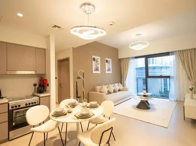 a kitchen and living room with a table and chairs at MH - ACT TOWER - Downtown -1Bedroom Apartment - REF504 in Dubai