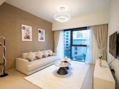 a living room with a couch and a table at MH - ACT TOWER - Downtown -1Bedroom Apartment - REF504 in Dubai
