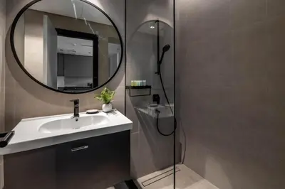 a bathroom with a sink and a mirror at GuestReady - Majestic canal and Burj Khalifa view in Dubai
