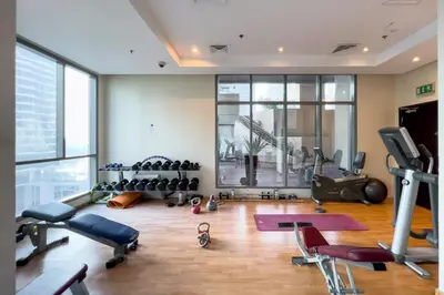 a gym with exercise equipment in a building at GuestReady - Modernity elegance in Dubai Marina in Dubai