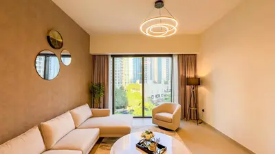 a living room with a couch and a table at MH - ACT Tower -Downtown- 2Bedrooms - REF 408 in Dubai