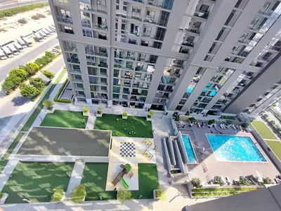 an overhead view of a large apartment building with a pool at New 1 bedroom in Sobha - Community View in Dubai