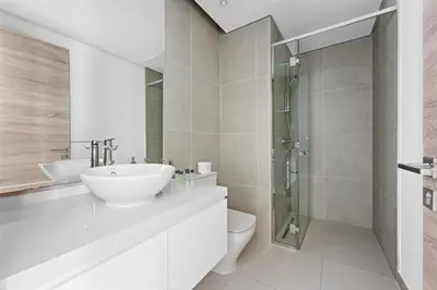 a bathroom with a sink and a toilet and a shower at StoneTree - Best Rate Studio in Dubai Marina in Dubai