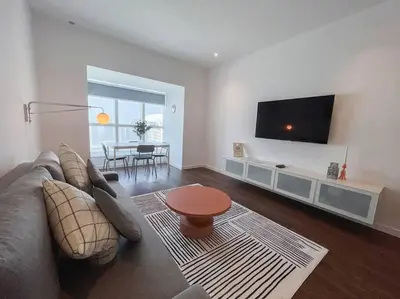 a living room with a couch and a flat screen tv at Deluxe - Amazing views - Elite in Dubai
