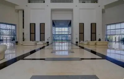 a large building with a lobby withwindows and a hallway at Nasma Luxury Stays - Elegant 1BR With Stunning View of Park Avenue in Dubai