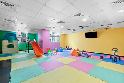 a room with a play room with a slide at Cozy Dubai Marina Design Studio close to Jumeirah Beach, Mall & Metro in Dubai