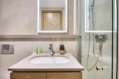 a bathroom with a sink and a shower at STAY BY LATINEM Luxury 1BR Holiday Home W 2709 Near Burj Khalifa in Dubai
