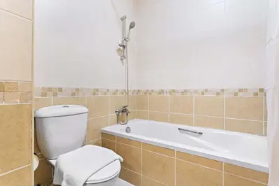 a bathroom with a toilet and a bath tub at Silkhaus New Studio in ASB Tower Walking distance to mall in Dubai
