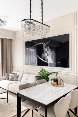 a living room with a table and a couch at Luxury 1 bedroom with beautiful marina view! in Dubai