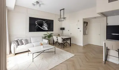 a living room with a couch and a table at Luxury 1 bedroom with beautiful marina view! in Dubai