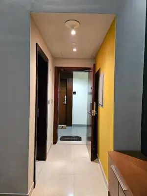 a hallway with a hallway leading to a room at The Sand Castle - Ubora Residence Tower, Business Bay, Burj Khalifa View in Dubai