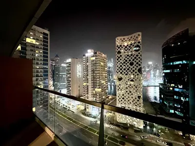a view of a city skyline at night at The Sand Castle - Ubora Residence Tower, Business Bay, Burj Khalifa View in Dubai