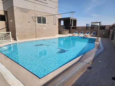 a swimming pool on top of a building at Elite 6 Residence - Sports City by Golden Casa in Dubai