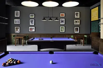 a billiard room with a purple pool table at Overlooking Marina Views Next to Marina Mall 1BR Unit, The Address Residences, Dubai Marina by Deluxe Holiday Homes in Dubai
