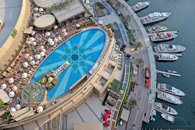 an overhead view of a pool at a resort at Urban Studio at The Address Residences Dubai Marina by Deluxe Holiday Homes in Dubai