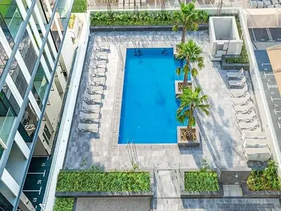 an overhead view of a swimming pool in a building at StoneTree - Furnished 2BR with floor-to-ceiling window in Dubai