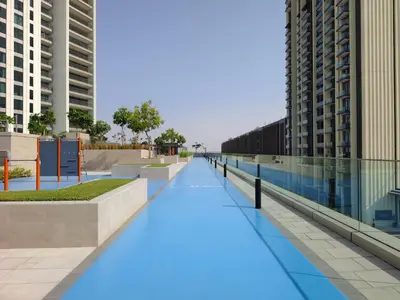 a walkway in the middle of a city with buildings at Phenomenal 2Br in Downtown Views II in Dubai