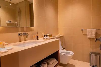 a bathroom with a sink and a toilet at Dubai Marina Gate 2 Deluxe Apartment in Dubai
