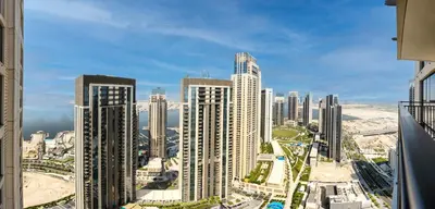 a view of a city skyline with tall buildings at Pleasant 2BD new apartment in Dubai Creek Harbour in Dubai