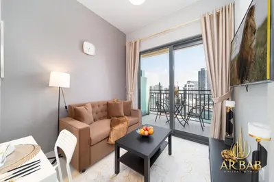 a living room with a couch and a table at Arbab Homes Luxury 1BR- Canal View - Damac Zada Tower in Dubai