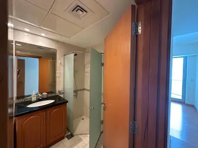 a bathroom with a sink and a mirror at Stylish Marina View Apartment in Dubai