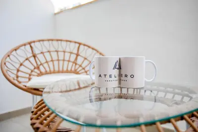 a coffee cup sitting on top of a glass table at Modern studio in Azizi Riviera in Dubai