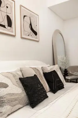 a bedroom with a bed with two pillows on it at Modern studio in Azizi Riviera in Dubai