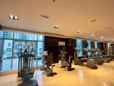 a gym with treadmills and cardio equipment in a building at Burj Residence 1, Downtown Dubai - Mint Stay in Dubai