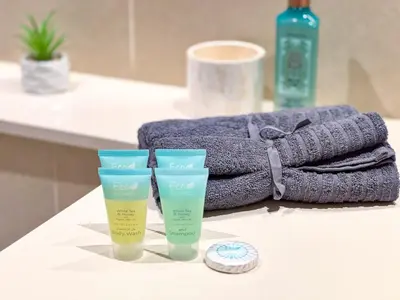 two cups sitting on a counter next to a towel at High floor Luxury 2BR - Dubai Marina Gate in Dubai
