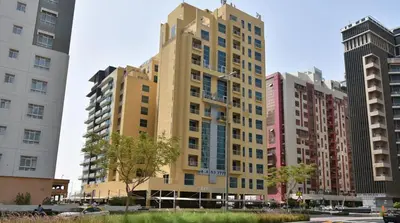 a tall building in a city with tall buildings at Charming Partition Room in Barsha Heights Near ICM in Dubai