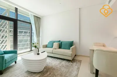 a living room with a couch and a table at Keysplease Beautiful 1 B/R Palm Jumeirah Beach Access in Dubai