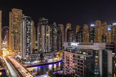 a view of a city at night with buildings at Luxury 1 Bedroom Full Marina View, Sleeps 6, 1 Min to Metro in Dubai