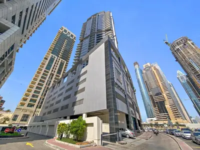 a tall building in a city with tall buildings at StoneTree - Fully Furnished 1BR in Dubai Marina in Dubai
