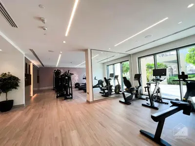 a gym with treadmills ellipticals and exercise bikes at Luxurious Apt with breathtaking view in Downtown in Dubai