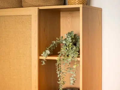 a wooden shelf with a potted plant on it at Cozy 1 BR in Dubai Marina in Dubai