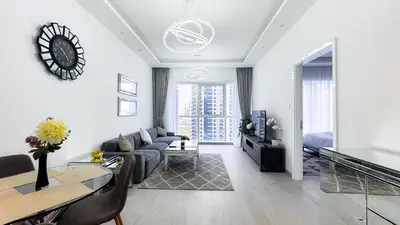 a living room with a couch and a table at Jumeriah Lake Tower(JLT)- (MAG214)(2) in Dubai