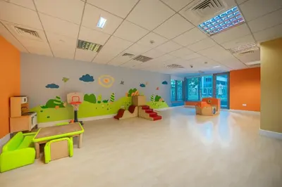 a childrens room with a green and orange wall at Bella Vista - 29 Boulevard Downtown - 2BR - Partial Fountain View in Dubai