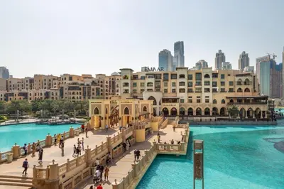 a bridge over a river with a city in the background at Frank Porter - Reva Residences in Dubai