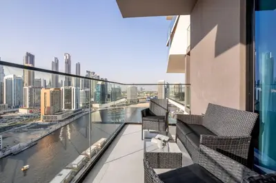 a balcony with chairs and a view of the city at GuestReady - Mesmerizing views of the Burj Khalifa in Dubai