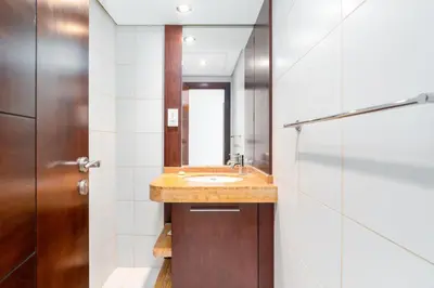 a bathroom with a sink and a mirror at Lux BnB Burj Views Tower I Downtown in Dubai