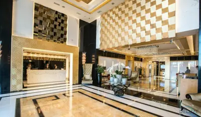 a lobby of a hotel with a large lobby at Chic 1BR at The Signature Downtown Dubai by Deluxe Holiday Homes in Dubai