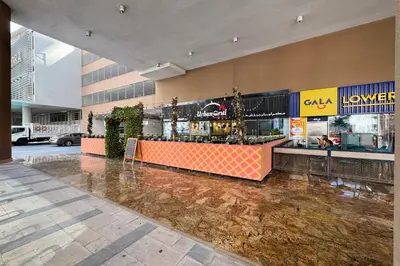 a restaurant with a counter in a building at Studio with Balcony Skyline View Business Bay in Dubai